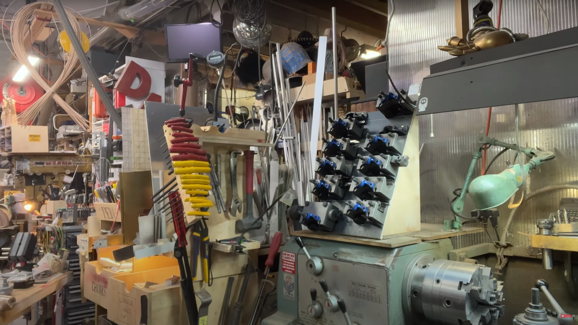 meeting-backgrounds/adam-savage-cave52-lathe-toolholders.png